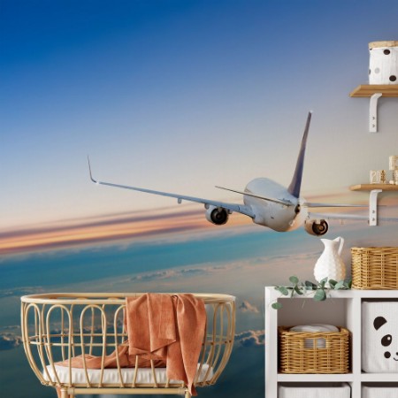 Bild på Flygplan som flyger över moln