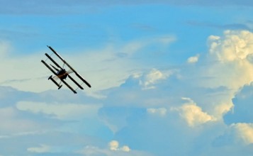 Picture of Antique Plane Flying on Blue Sky