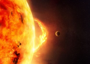 Picture of The Sun - Solar Flare An illustration of the sun and sun flare with a planet to give scale to the size of the flare