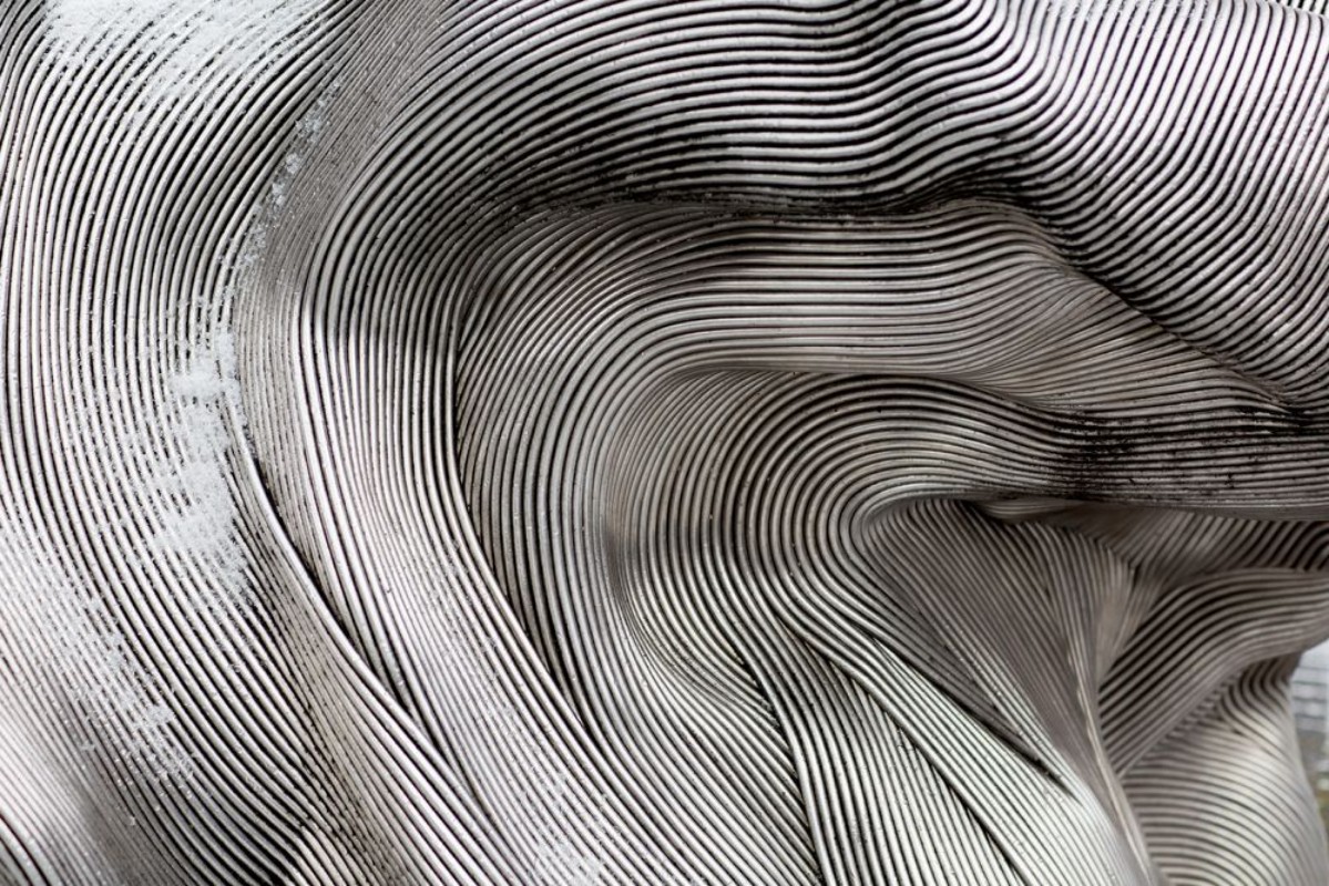 Picture of Background texture of the shining metal surface The curved plate is made of iron