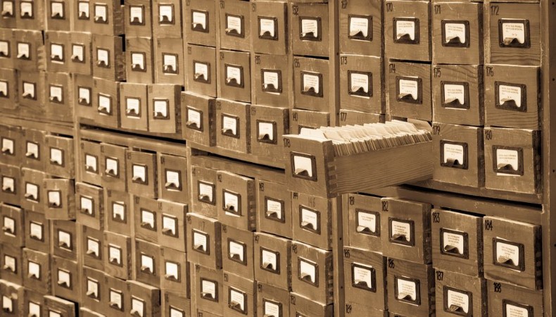 Old library or archive reference catalog with one opened card drawer Database and knowledge catalogue concept photowallpaper Scandiwall