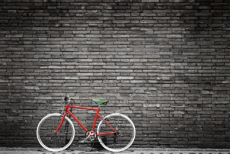 Afbeeldingen van Black and white photo of red bicycle - vintage film grain filter effect styles