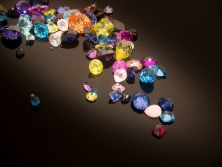 Picture of Jewel on black shine color Collection of many different natural gemstones amethyst lapis lazuli rose quartz citrine ruby amazonite moonstone labradorite chalcedony blue topaz