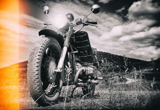 Bild på FreedomMotorbike under skyVintage photo effect added for create atmosphere