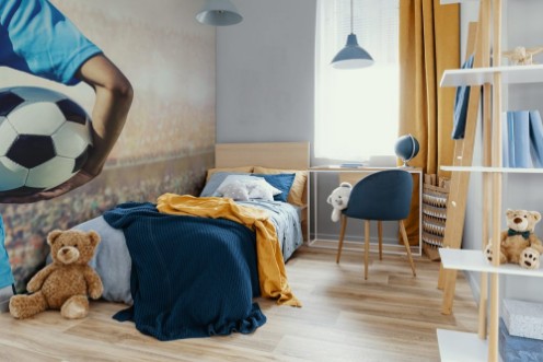 Picture of Soccer football player in blue team concept holding soccer ball