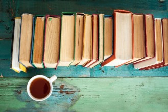 Imagem de Reading book with coffee on table