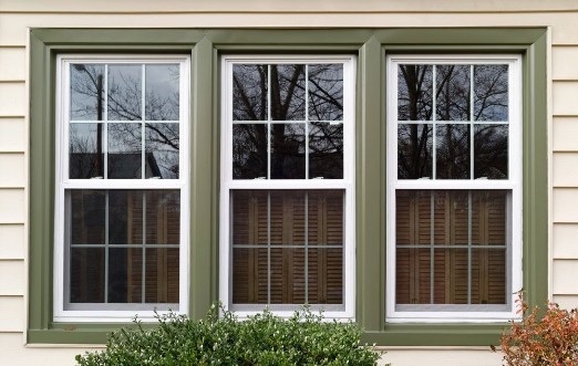 Picture of New white with green trim vinyl replacement windows Horizontal