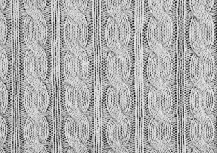 Снимка на Grey knitted textured background with a pattern closeup