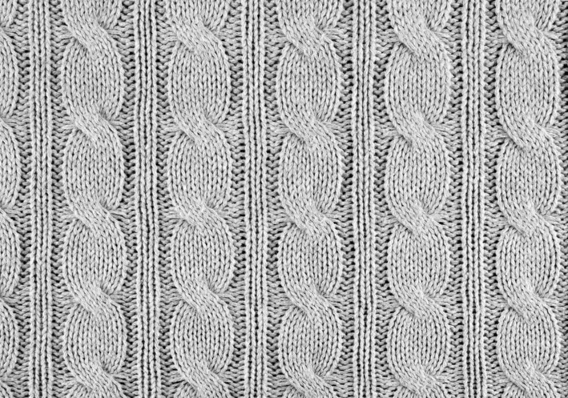 Picture of Grey knitted textured background with a pattern closeup