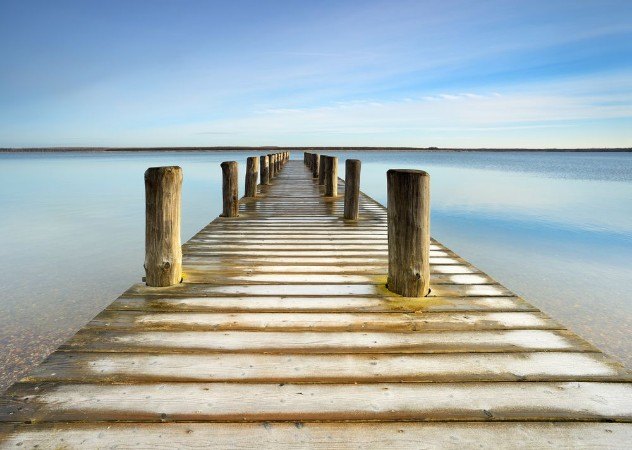 Picture of Wooden Pier with Hoarfrost leads into a calm clear  lake