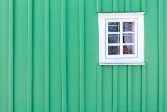 Bild på The old window of old wooden house Background of wooden walls