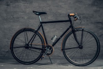 Picture of An authentic vintage single speed bicycle over grey background