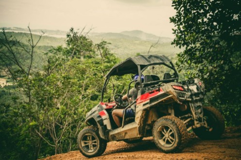 Afbeeldingen van Extreme ride on ATV buggies jeeps Journey through the jungle Extreme quad biking dune buggy Jeep in the jungle forest  ATV UTV  in motion  toned image