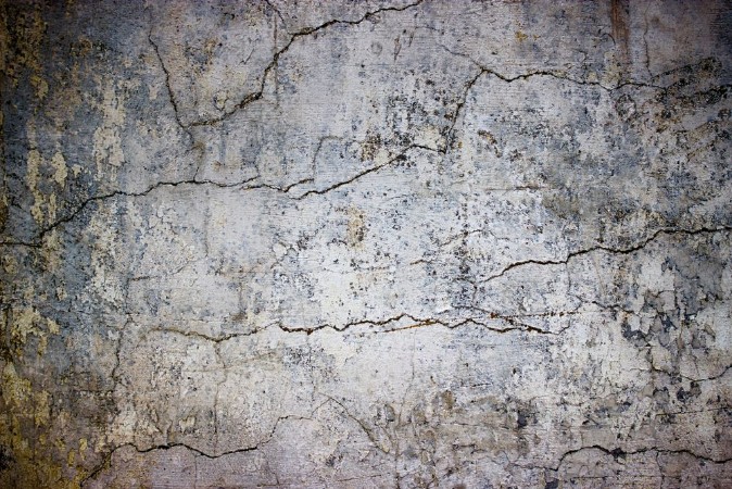 Kép Cracked concrete wall covered with gray cement texture as background for design