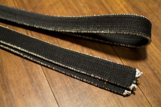 Bild på Black belt of martial arts on the floor