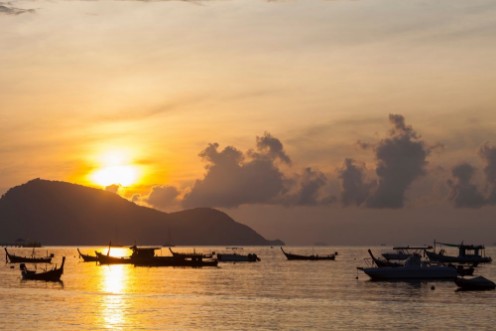 Picture of Beautiful sunrise seascape view with boat in phuket island