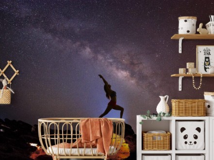 Afbeeldingen van Landscape with Milky way galaxy Night sky with stars and silhouette woman practicing yoga on the mountain