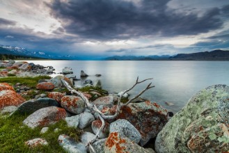 Pilt Cloudy sunset on a mountain lake Mongolia