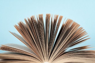 Picture of Book stacking Open book hardback books on wooden table and blue background Back to school Copy space for text