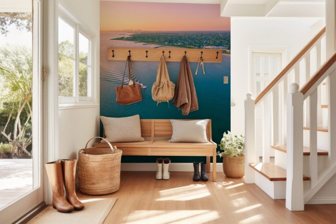 Bild på Aerial view of boat sailing across Port Phillip bay with Melbourne coastline and suburban areas in the background at beautiful sunset