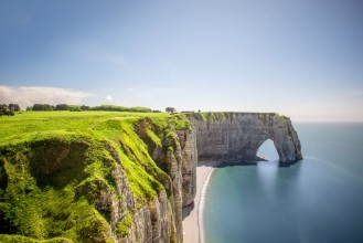 Picture of Landscape view on the famous rocky coastline near Etretat town in France during the sunny day Long exposure image technic with soft water