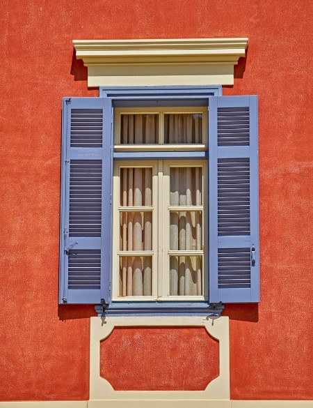 Picture of Elegant vintage window on orange house wall