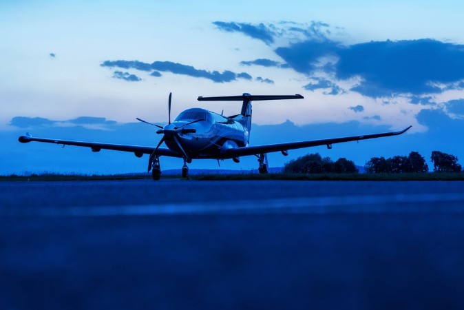 Picture of Single turboprop aircraft on evening runway