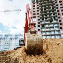 Bild på Excavator rakes bucket sand Construction work on site