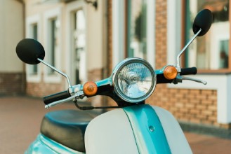 Picture of Close up view retro scooter parked on city street