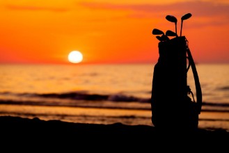 Bild på Idyllic shot of sunset and golf clubs
