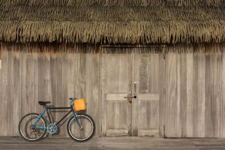 Picture of Wooden walls with doors and bicycles parked