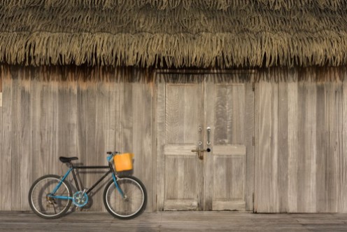 Picture of Wooden walls with doors and bicycles parked