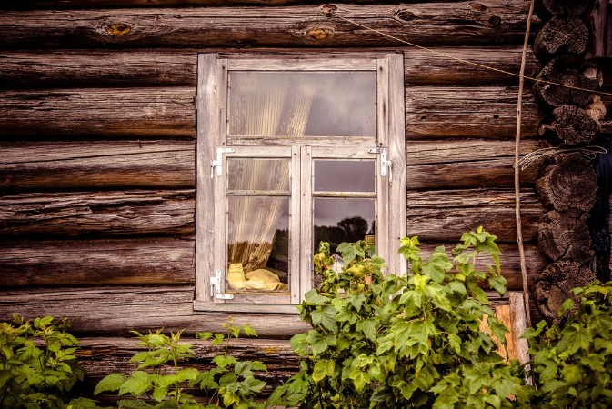 Picture of Glazed window of an old abandoned wooden house