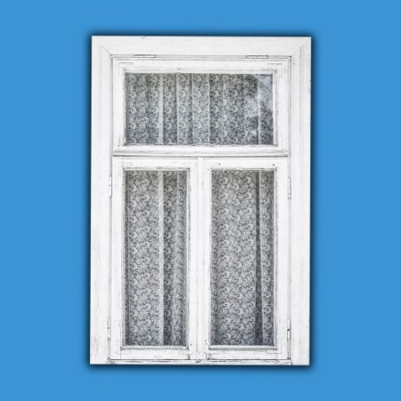 Picture of Old white paint wooden window isolated on blue