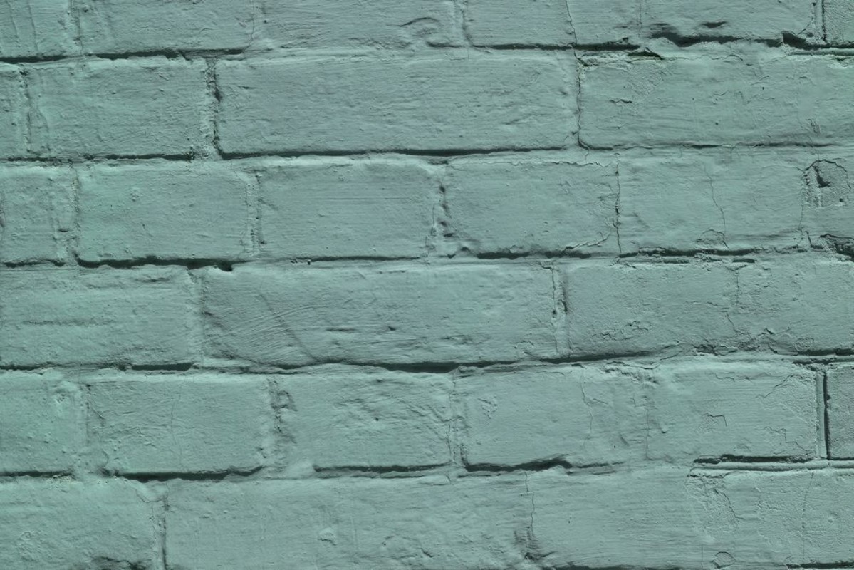 Picture of Brick wall covered with green lime