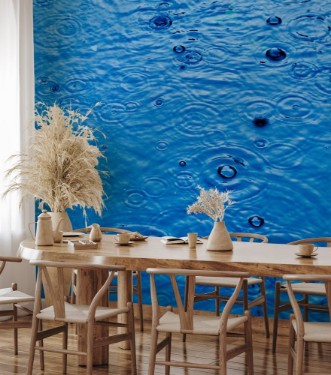 Picture of Rain drops on the surface of a street road on a rainy day toned blue