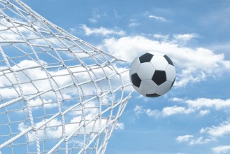Picture of 3d rendering of a football ball flying away from inside the gate net and tearing it