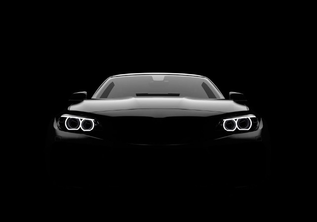 Picture of Front view of a generic and brandless modern car on a black background