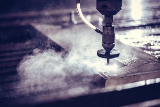 Picture of Water jet cutter machine cutting steel plate