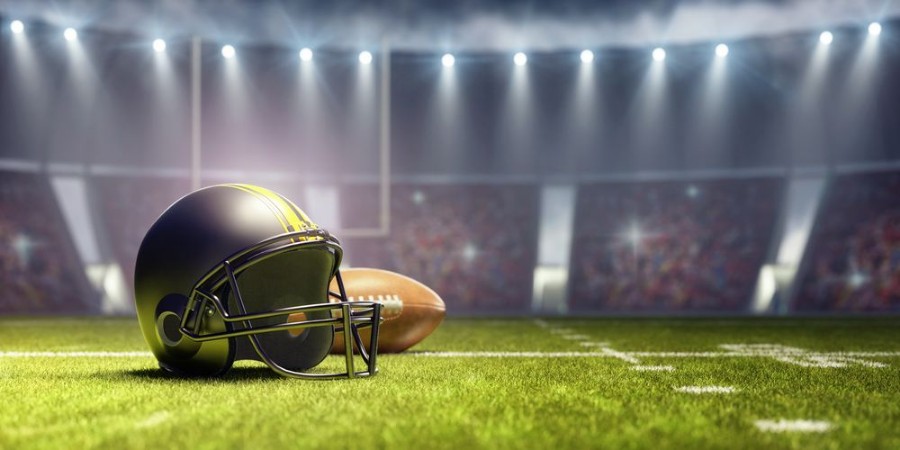 Imagem de American football background with ball and black helmet 3D Rendering