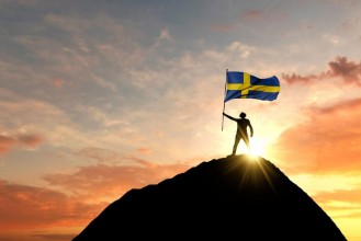 Picture of Sweden flag being waved at the top of a mountain summit 3D Rendering