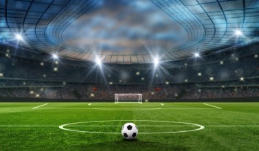 Bild på Ball on the green field in soccer stadium ready for game in the midfield