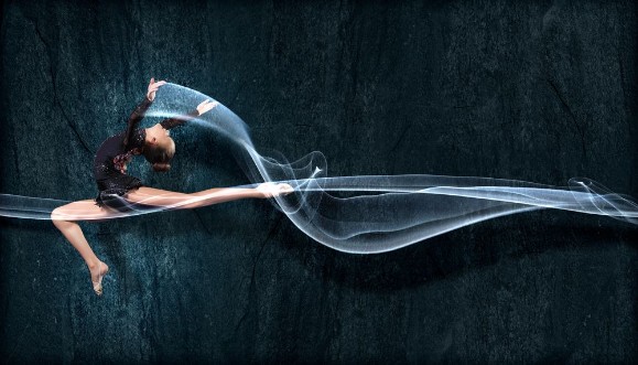 Picture of Young woman in gymnast suit posing