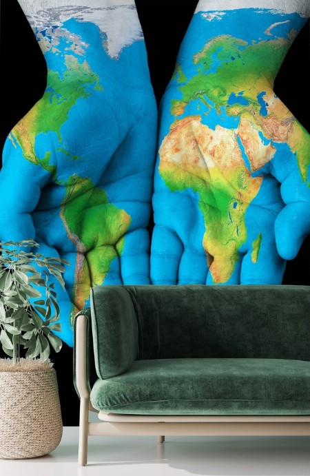 Picture of Map painted on hands showing concept - the world in our hands