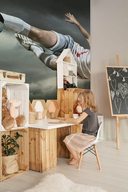 Picture of Football player with ball in action under rain outdoors