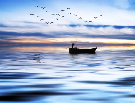 Afbeeldingen van Pescando entre olas azules