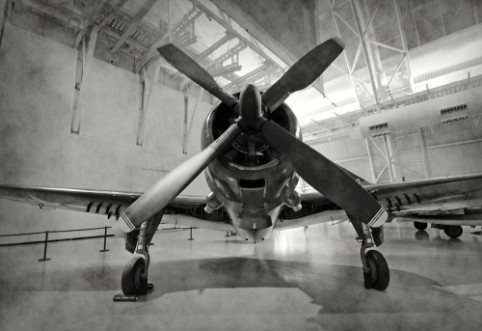 Old airplane in a hangar photowallpaper Scandiwall