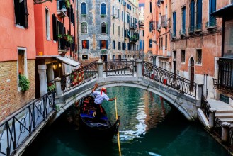 Picture of Venice Italy - Gondolier and historic tenements