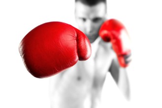 Afbeeldingen van Black and white fighter with red gloves Bokeh