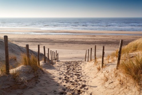 Afbeeldingen van Sand path to North sea at sunset